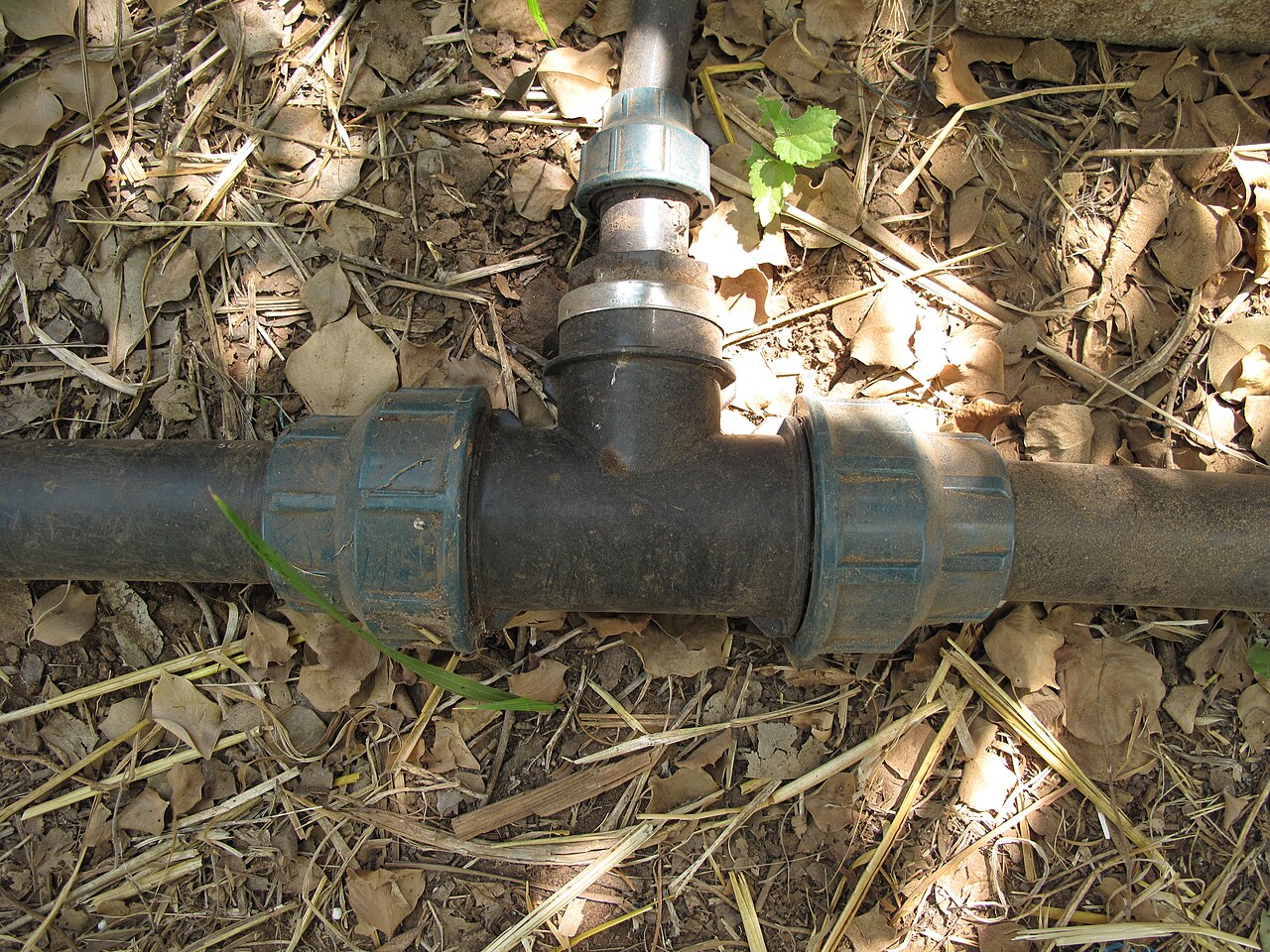 irrigation pipe fitting on ground