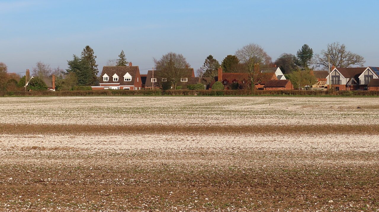 Limestone spread over the field surface before plowing