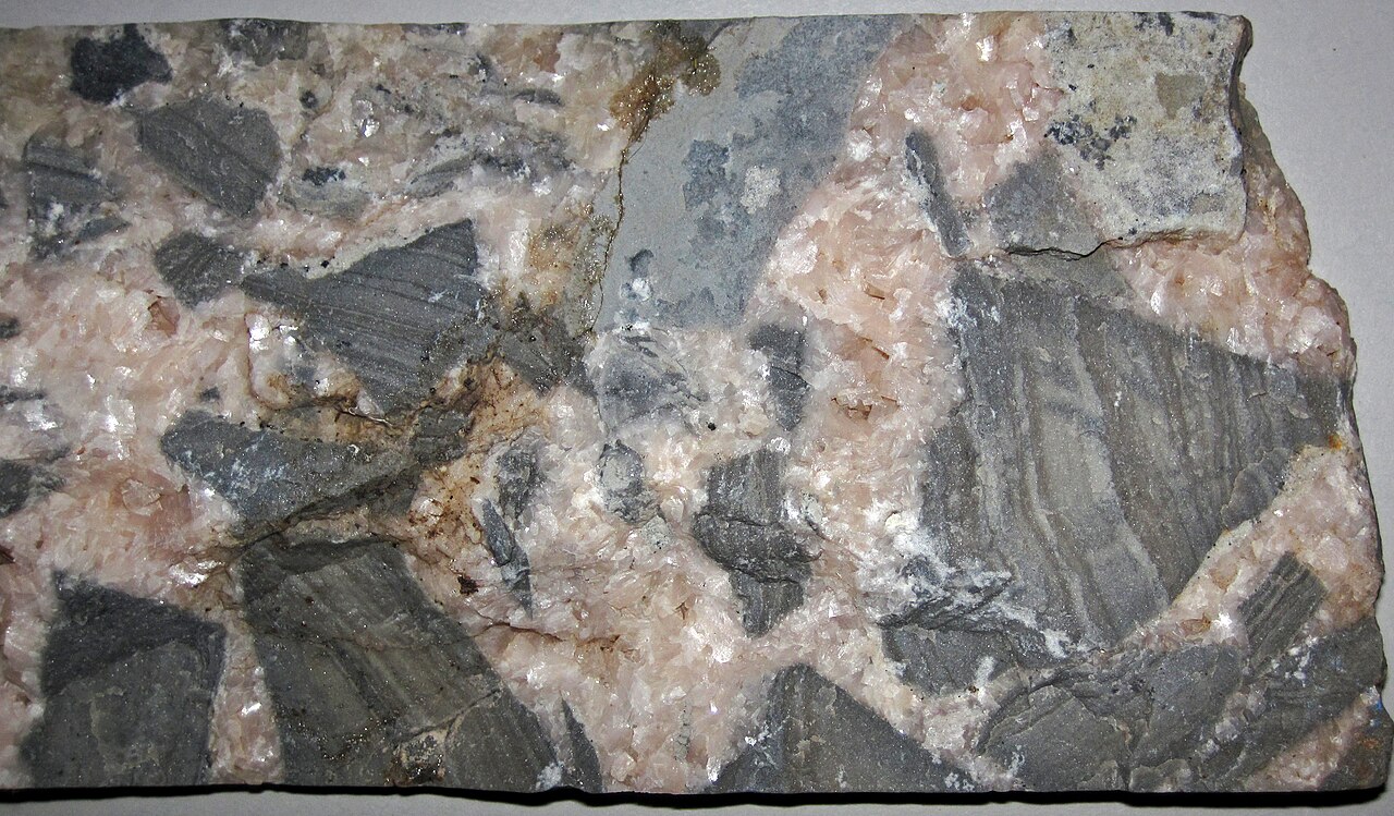 Dolomite (calcium-magnesium carbonate) — raw material for dolomitic lime, which simultaneously raises soil pH and adds magnesium