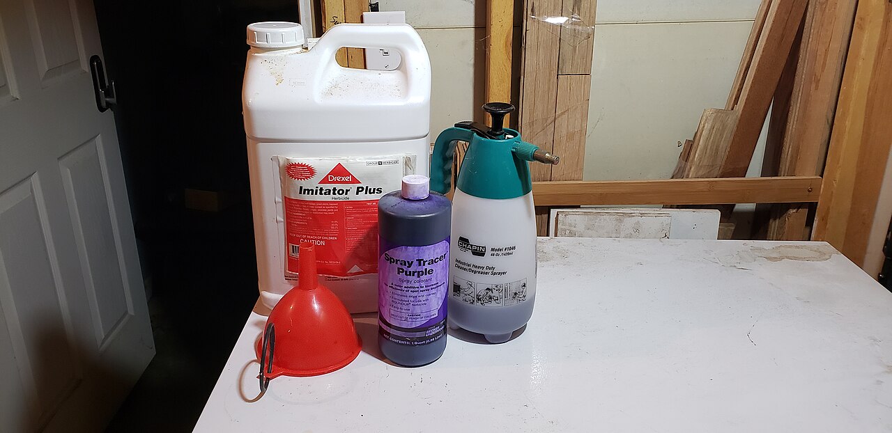 Sprayer with glyphosate herbicide solution prepared for application