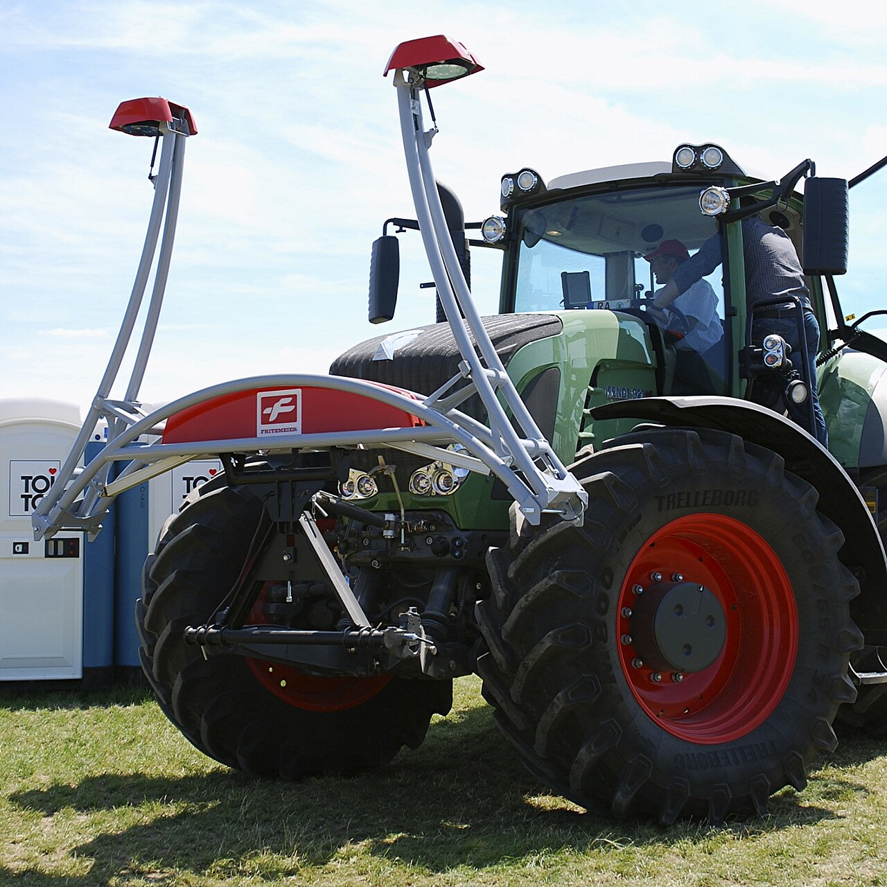 tractor with hazelnut harvesting attachment