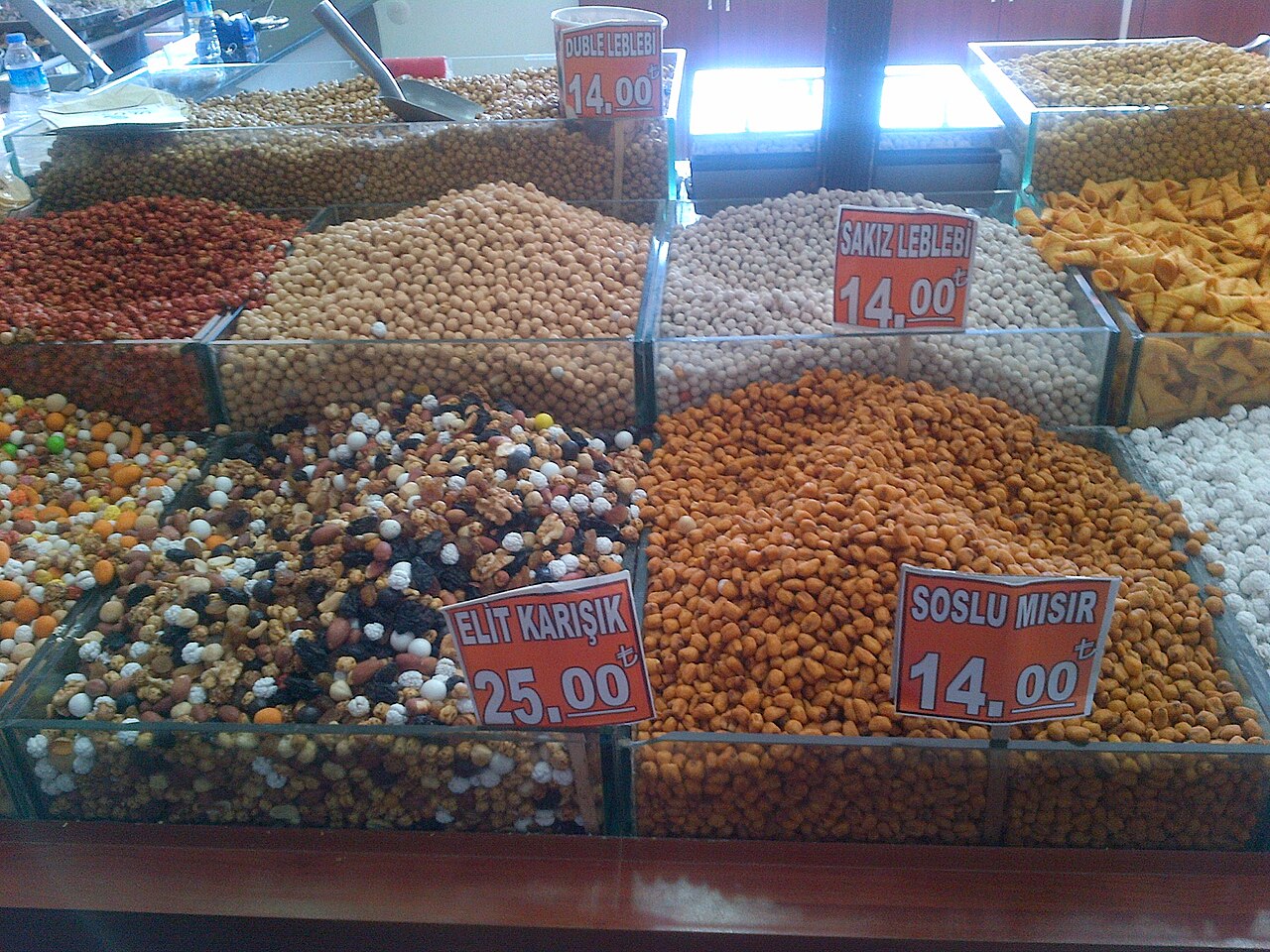 Stand with dried fruits and snacks at a market