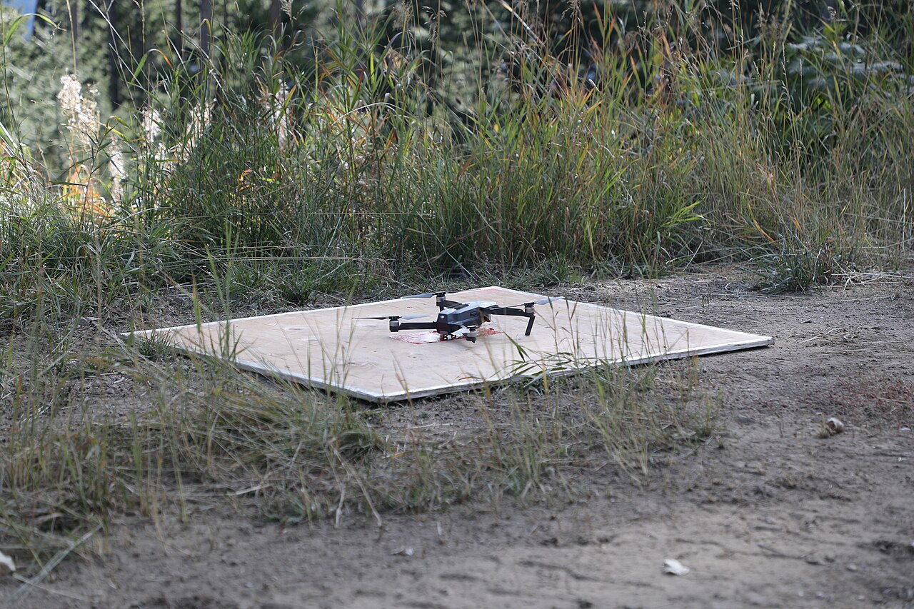 drone on landing pad in field